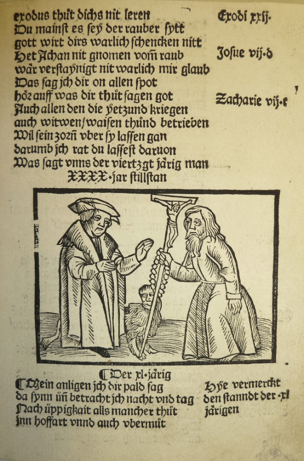 Ein Blatt Papier mit gedrucktem Text in einer unbekannten Sprache, mit zwei Männern daneben, möglicherweise aus einem Lehrbuch.