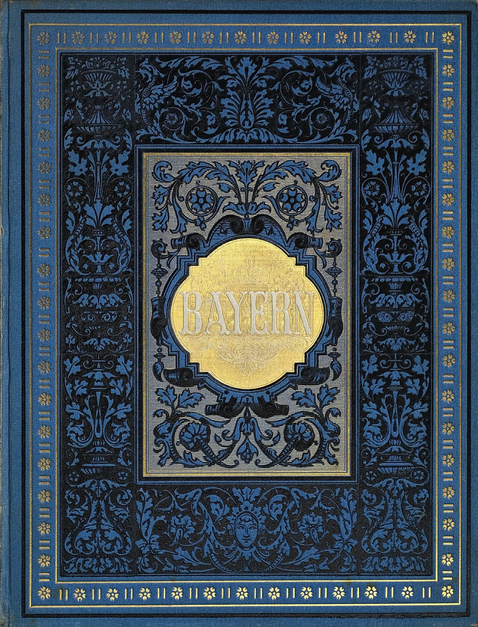 Blau-goldenes Buch mit "Bayern" auf dem Cover mit detaillierten Designs.