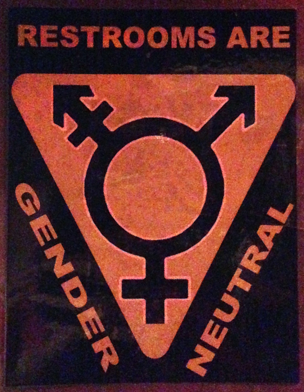 Plakat mit dem Text "Toiletten sind genderneutral" betont die Bedeutung von Geschlecht in Toiletteneinrichtungen.