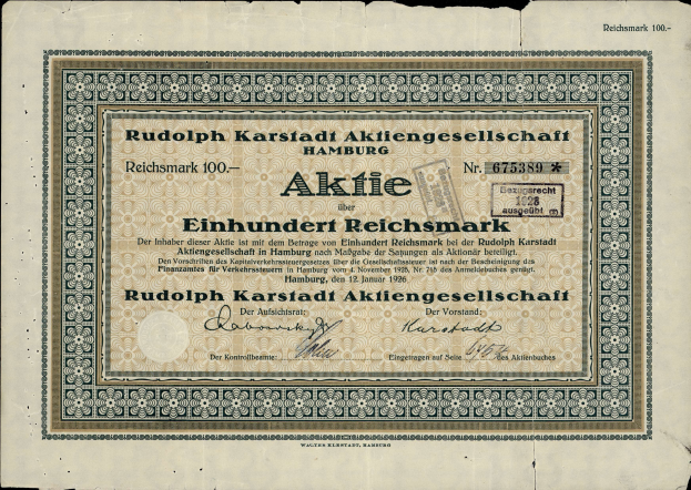 Eine alte deutsche Banknote mit einem schwarzen Hintergrund und dem Text "Rudolph Karlstadt Aktiengesellschaft Hamburg" darauf geschrieben.